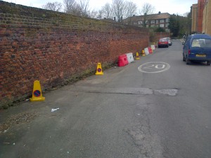 Shorts Road looking south towards St. Philomena's School wall